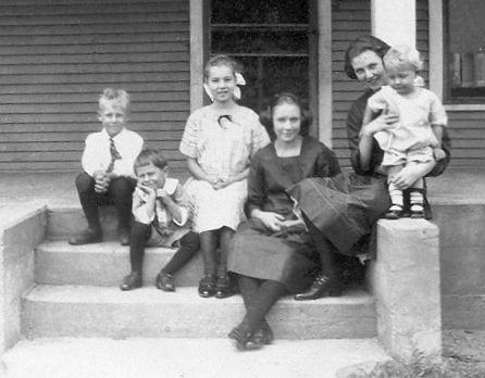  The children of Walter & Eva (Shafer) Holman on the steps of their home near Sharon, Kansas, about 1921 or 22.  Left to right: Walter Victor, Arthur Vernon (I'm not sure which is which on these two), Emma Josephine, Lozina Pearl, Lena Frances, Melvin Vade Holman.

Photo courtesy of Della M. Shafer.