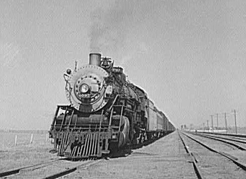 Kiowa, Kansas. Freight train pulling out on the Atchison, Topeka and Santa Fe Railroad between Wellington, Kansas and Waynoka, Oklahoma.

Photo by Jack Delano, March 1943, Library of Congress collection, public domain.