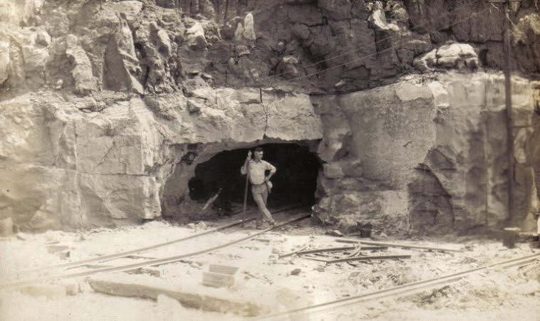 Miner stands in the entrance of an adit of a gypsum mine near Sun City, Barber County, Kansas.

Photo from the collection of Beth (Larkin) Davis.

CLICK HERE to view larger image.