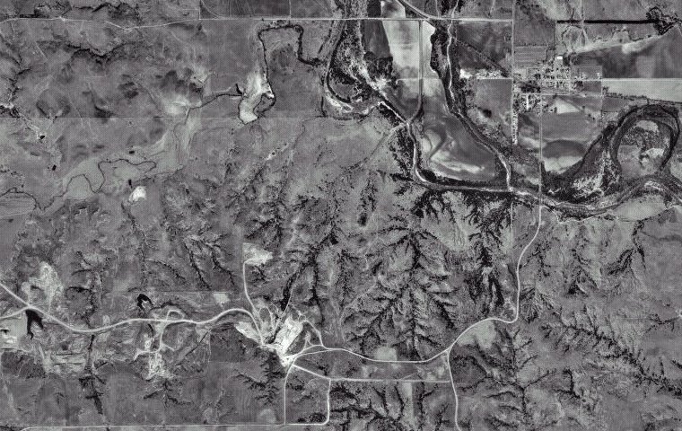 USGS aerial photograph of Sun City, at upper right, and the gypsum mine, at lower left, Barber County, Kansas, 20 March 1996.

CLICK HERE to view the image on TerraServer USA.