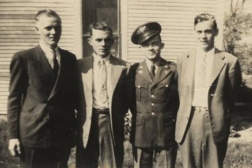 From left: Delmer 'Buck' Ferrin, Forrest Smith, Calvin Smith and Wendel Ferrin at Ernest & Nellie Ferrin's house east of Wilmore, Comanche County, Kansas, about 1943 or 1944. Photograph from the collection of Wendel Ferrin.