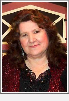 Linda Winter in front of the Wilmore Opry backdrop at the October 2nd, 2004, Wilmore Opry.