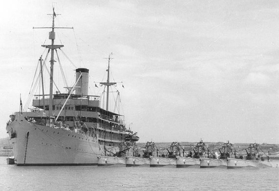 USS Canopus (AS-9), with the Asiatic Fleet's Submarine Squadron Five alongside, during the 1930s.
The submarines present include (from left to right): S-37 (SS-142); S-40 (SS-145); S-36 (SS-141); S-38 (SS-143); S-41 (SS-146); S-39 (SS-144).
US National Archives photo # 80-G-1014615, a US Navy Photograph, now in the collections of the National Archives.